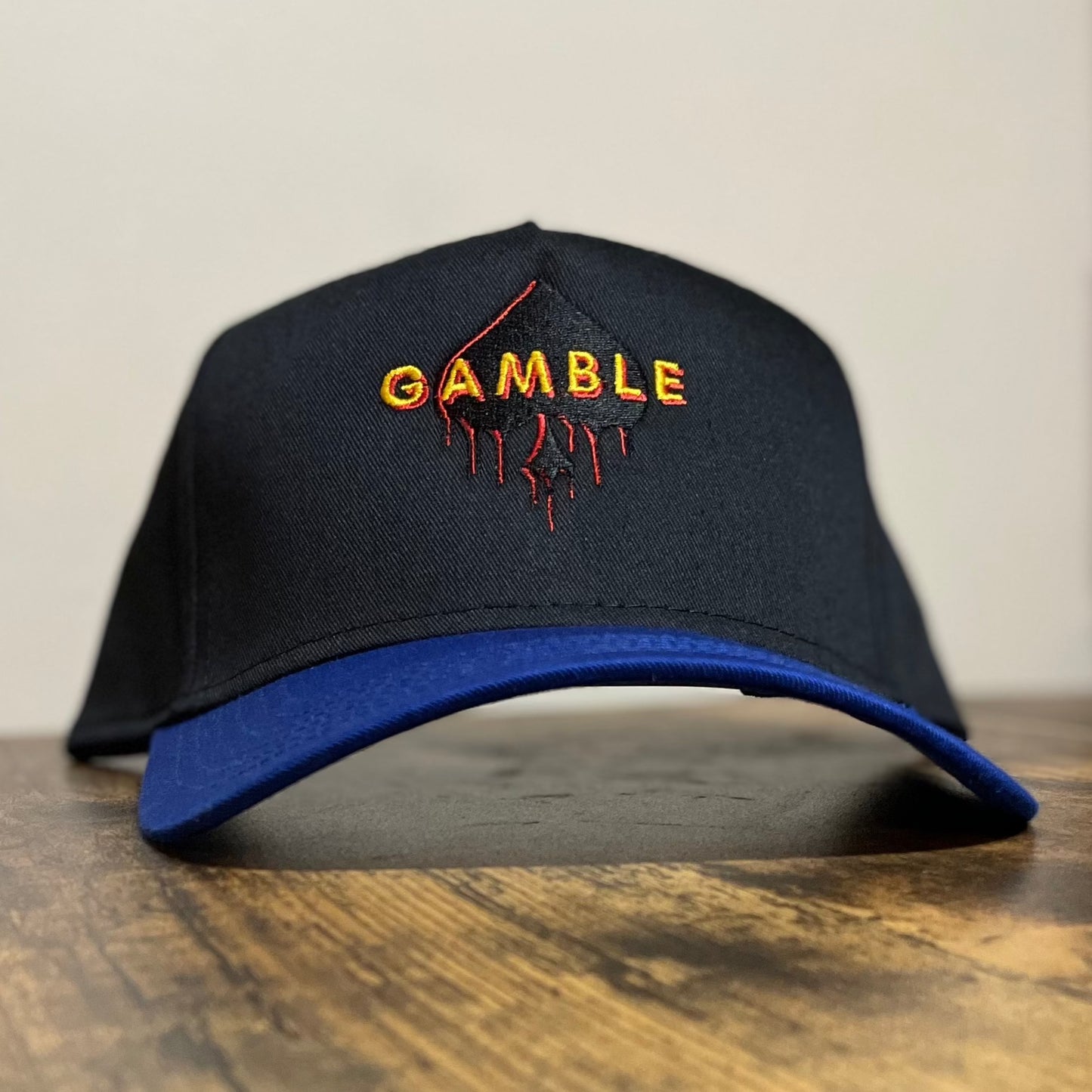 Spade Drip Snapback in blue and black featuring an iconic spade logo, made with high-quality materials for durability.