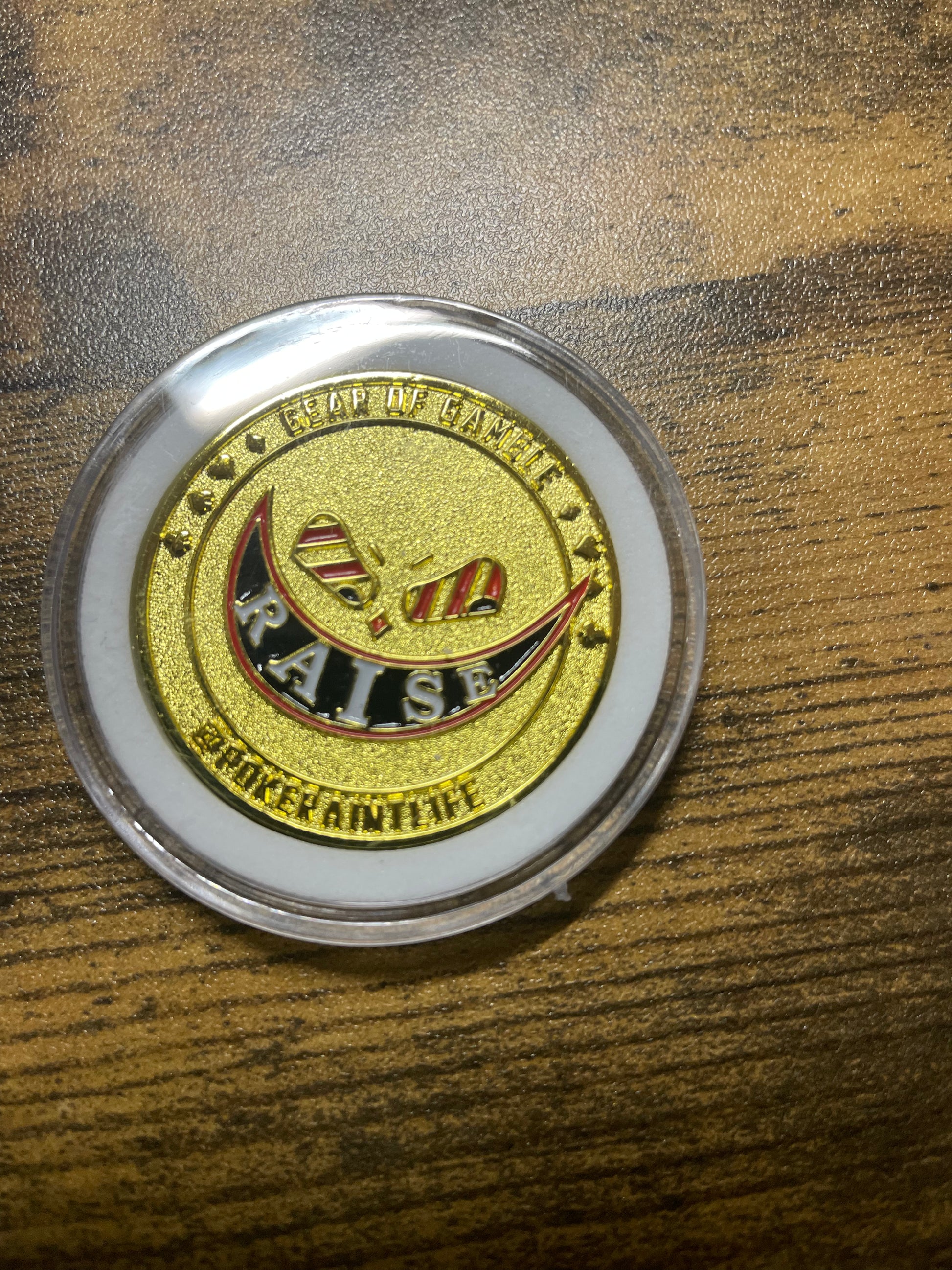 Premium metal poker card protector with ‘Raise’ art on side. Perfect poker accessory to protect your cards while adding style to your poker gameplay. A must-have for serious poker players.