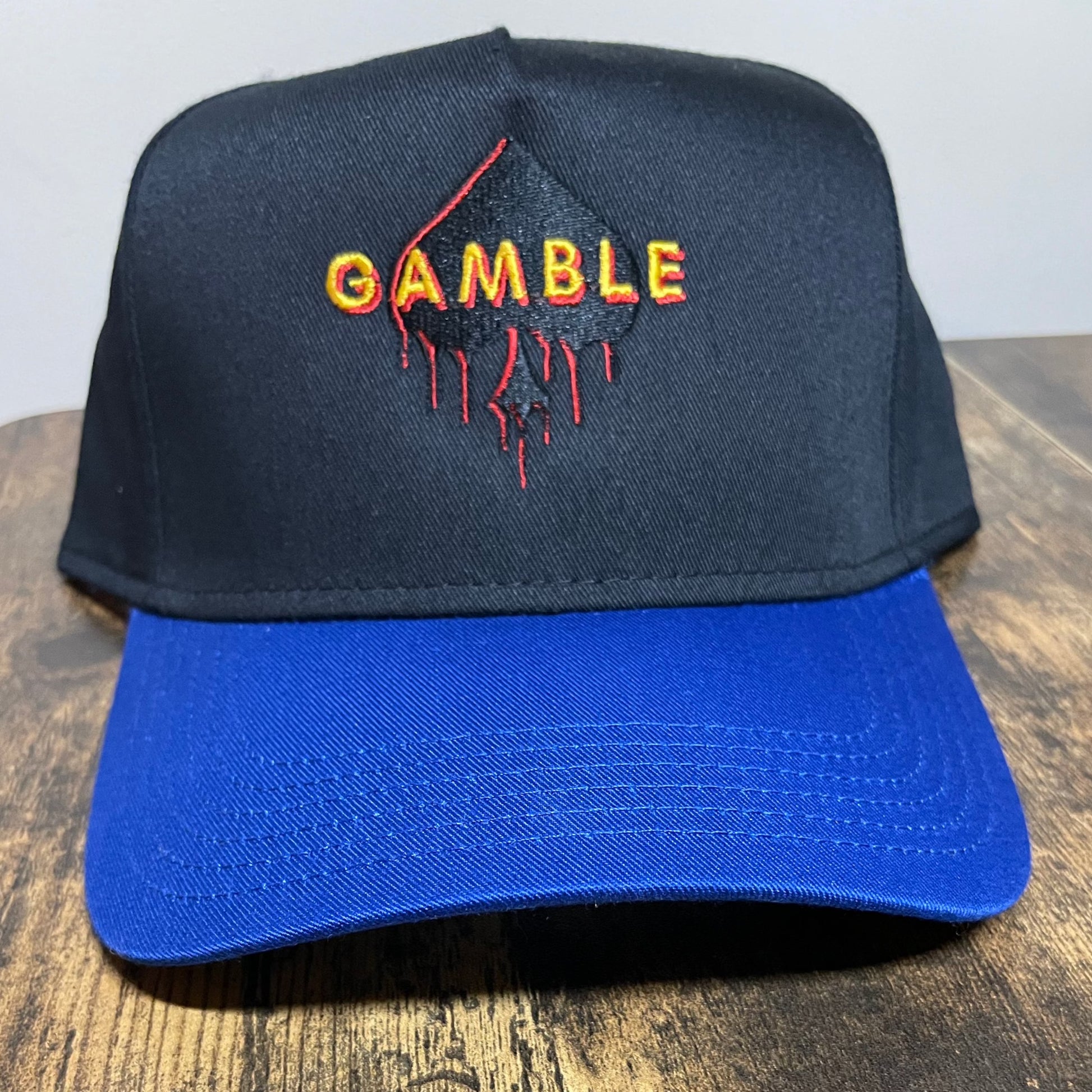 Spade Drip Snapback in blue and black featuring an iconic spade logo, made with high-quality materials for durability.