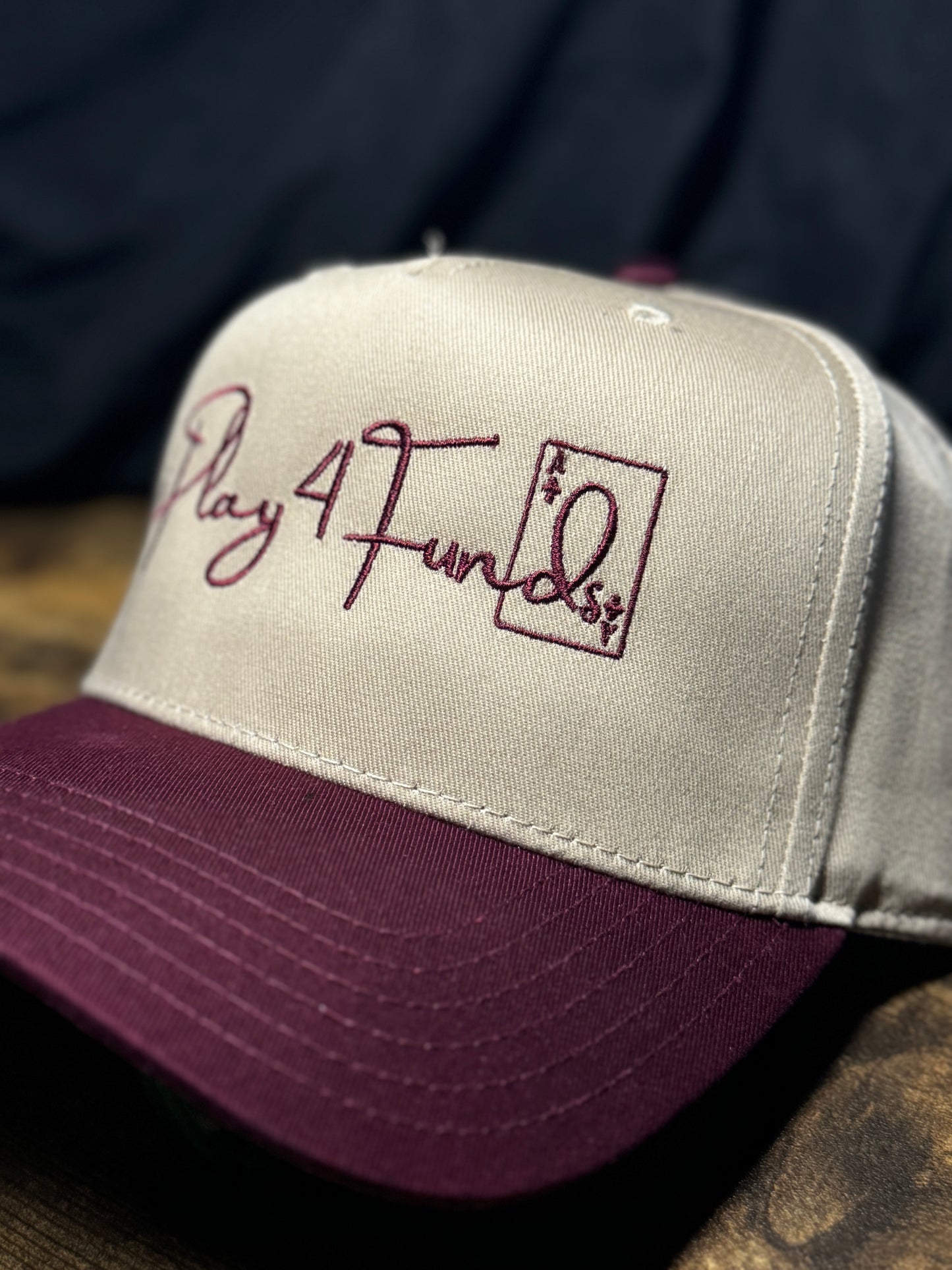 Maroon and khaki poker snapback with red brim and bold embroidered poker gear lettering. Perfect poker clothing for players who want to showcase their passion and style at the tables.
