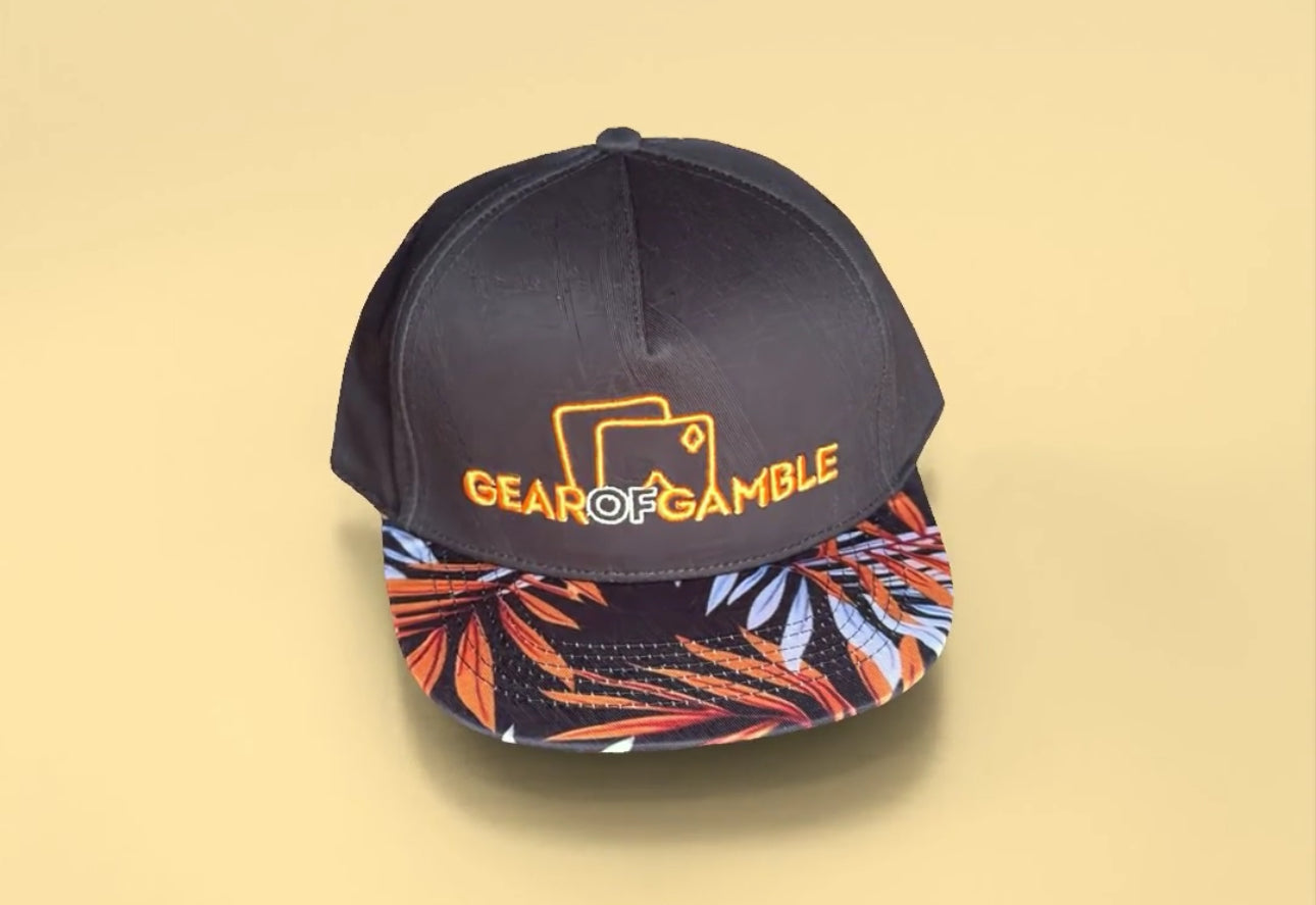 Black snapback hat with a bold leaf-patterned brim and Gear of Gamble logo on the front. Perfect poker apparel for players who want to showcase their love for the game with a unique twist