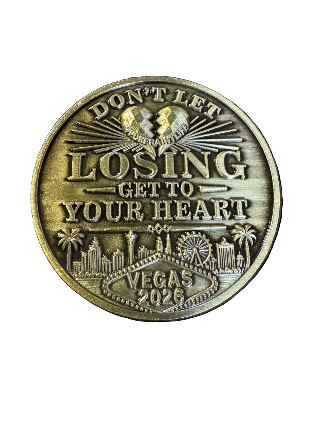 gold card protector coing that says dont let winning go to your head on one side and dont let losing go to your heart on the other side.
