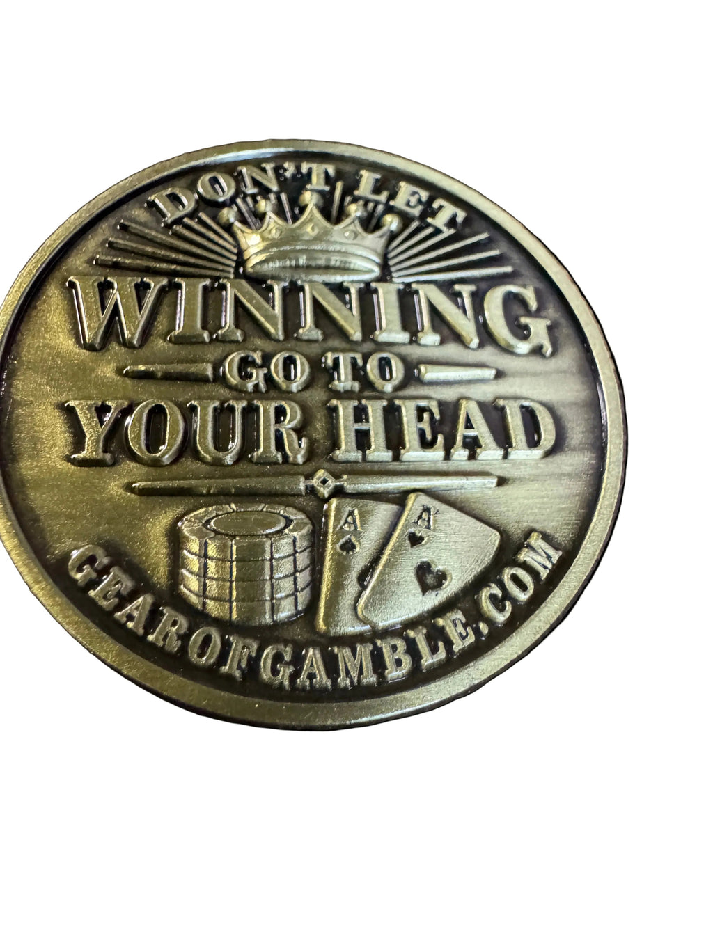 gold card protector coing that says dont let winning go to your head on one side and dont let losing go to your heart on the other side.