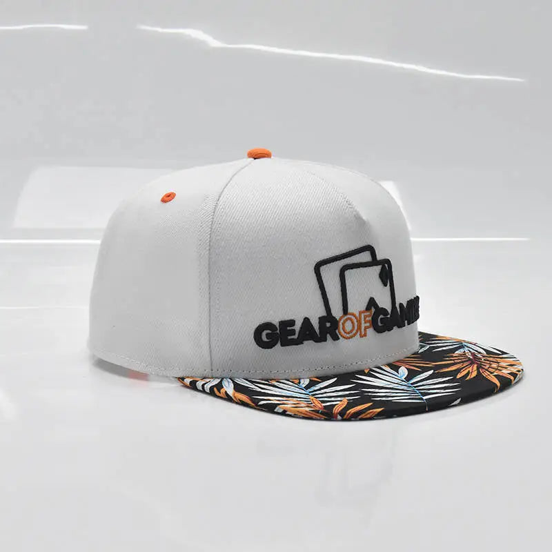 white snapback hat with a bold leaf-patterned brim and Gear of Gamble logo on the side. Perfect poker apparel for players who want to showcase their love for the game with a unique twist