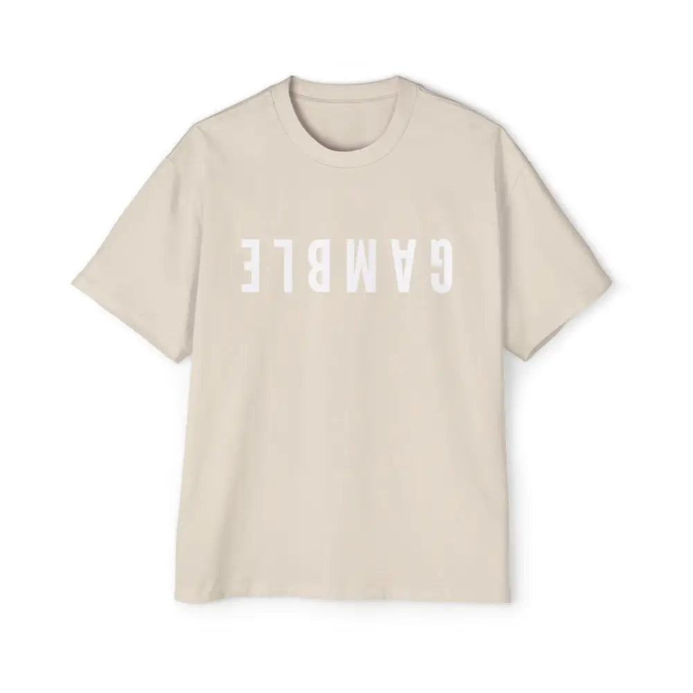 A creme oversized t-shirt with the word 'GAMBLE' printed in white letters on the front.
