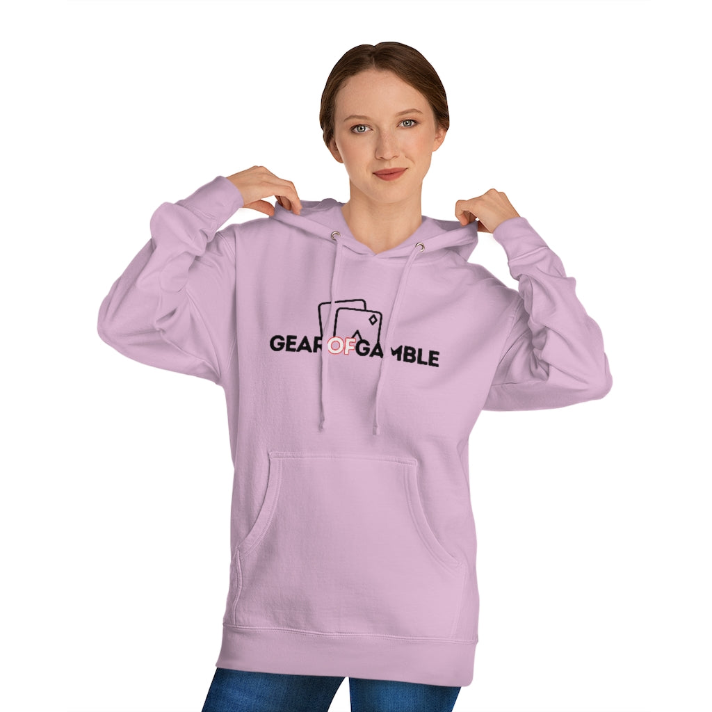 Woman wears Light pink poker hoodie featuring the bold Gear of Gamble logo on the front. Made from a soft cotton blend for ultimate comfort during long poker sessions, perfect poker apparel for players who want to rep their poker lifestyle
